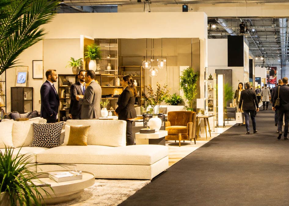 Furniture and interiors exhibition hall with visitors and exhibitors
